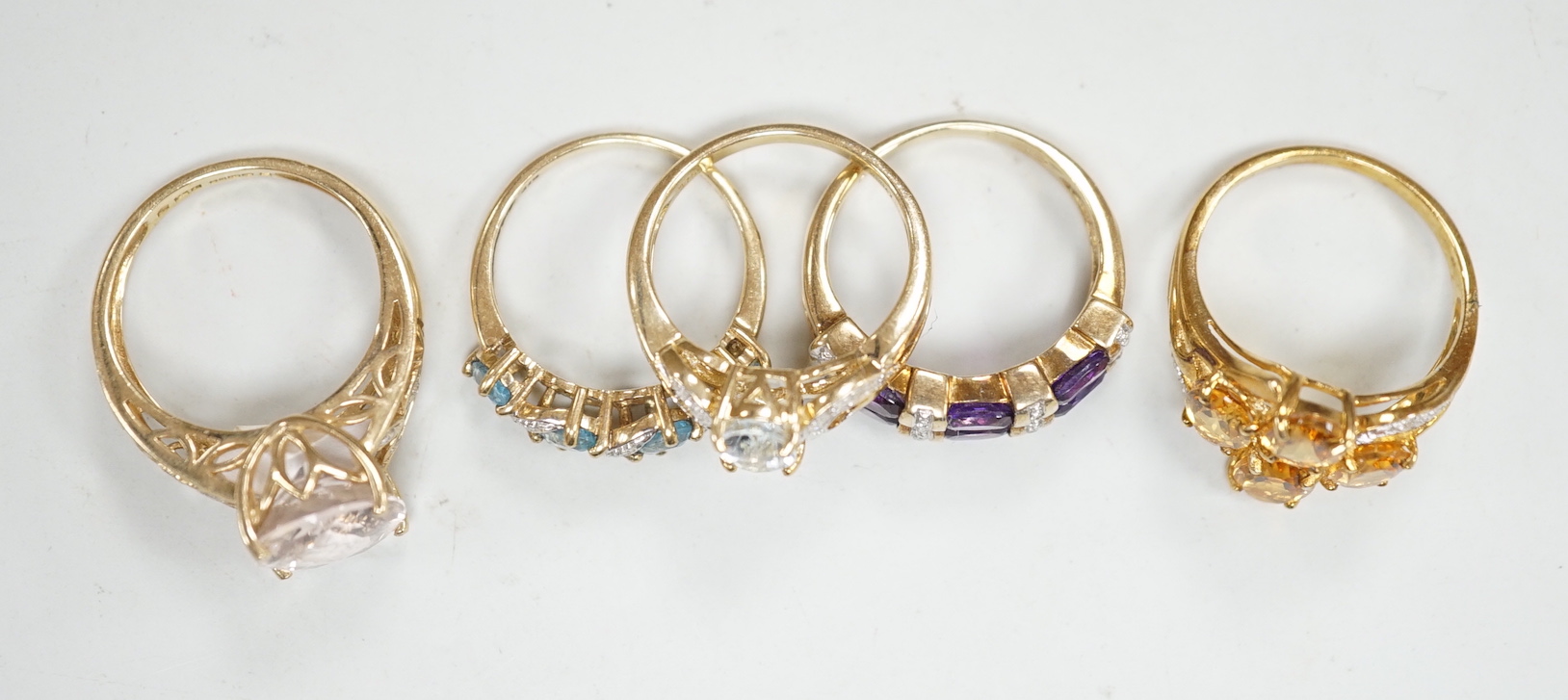 Five assorted modern 9ct gold and gem set dress rings, including citrine and diamond and amethyst and diamond, gross weight 14.8 grams.